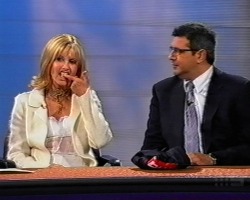 putting her teeth back in Olivia Newton-John Footy Show 2003