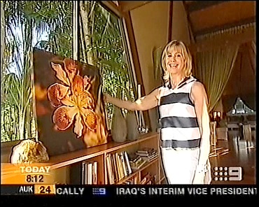 Olivia with one of her mom's photos screenshot